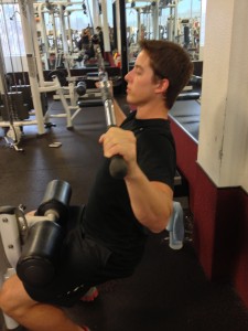Oakland+University+student+Chris+Beier+performing+the+front+lat+pulldown+exercise.+%28MICHAEL+CARAVAGGIO%2FThe+Oakland+Post%29