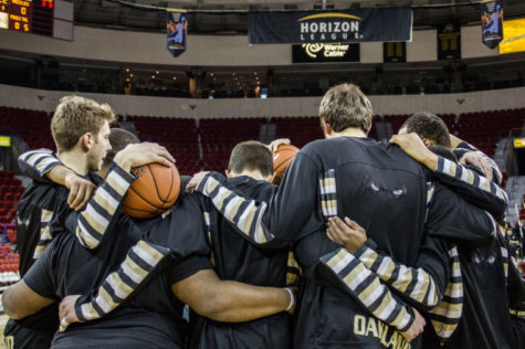 Members of the Oakland University mens basketball team huddle before their Horizon League tournament game against Wright State on Saturday, March 8th, 2014 in Green Bay.