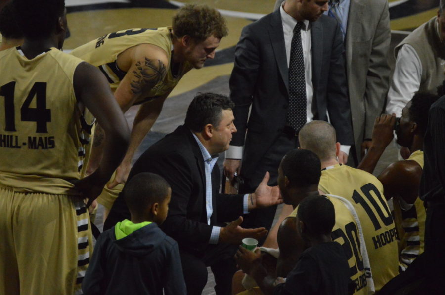 Head coach Greg Kampe talks to the team during a timeout in the first half of the game against Wright State. 