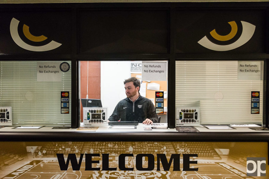 Fleetwood Fleming, ticket coordinator at Oakland University Athletics works on ticket sales behind the ticket window at the Orena. 