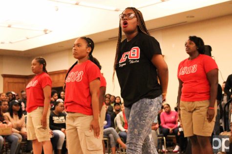 Delta Sigma Theta sorority girls chant and perform for the crowd.