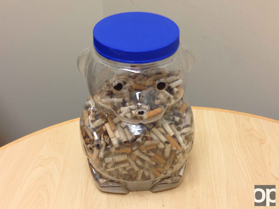 Health and Wellness Coordinator Erica Wallace collected used cigarettes around campus within an hour that almost filled up the bear jar on her desk. 