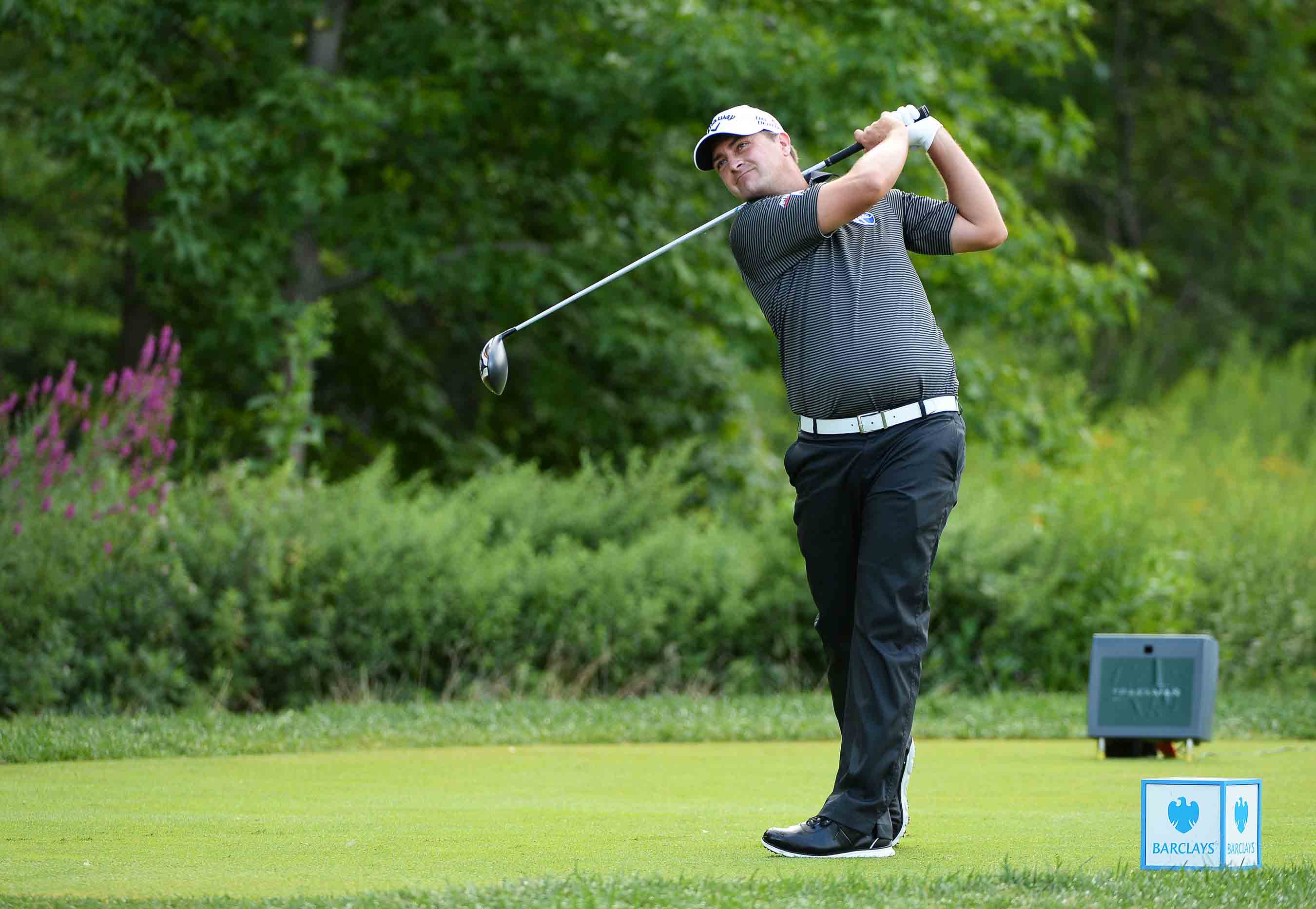 Brian Stuard plays his shot from the ninth tee during the third round of The Barclays at The Ridgewood Country Club on August 23, 2014 in Paramus, New Jersey.