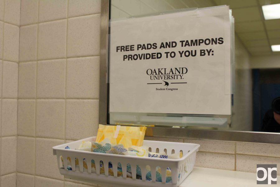 In the womens restroom in the basement of the Oakland Center, OUSC provides free tampons and pads.