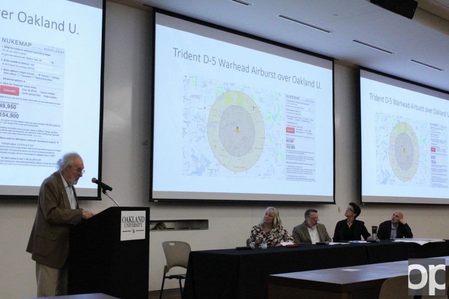 Wayne State professor Alvin M. Saperstein demonstrates what the blast radius of a nuclear bomb would look like over familiar places.