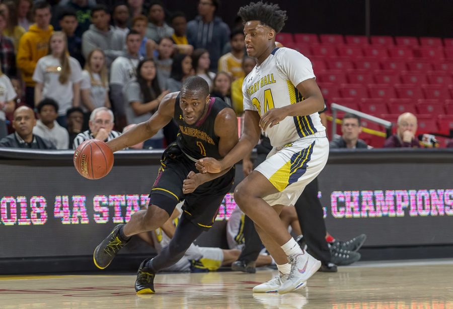 College Park, MD - Saturday, March 10, 2018: Bladensburg Mustangs forward Daniel Oladapo (1) is pressured by Perry Hall Gators forward Anthony Higgs (24) during the MPSSAA Boys Basketball 1A championship game held at Xfinity Center in College Park.