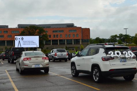 Many vehicles were decorated for graduation. All vehicles were facing toward a large screen, where all information and videos were shown in the fall graduation ceremony. All OU graduates receive a collection of benefits because of their time at OU.