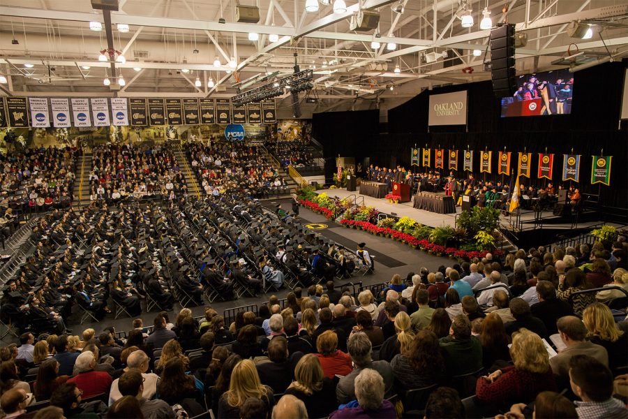 Students gather for a past in person commencement ceremony. This year Oakland University has taken an alternative approach with a drive-in commencement in the fall and, now, a virtual winter commencement.