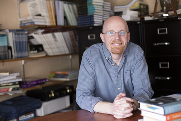 Virgil Zeigler-Hill sits at his desk at Oakland University. He has a doctorate in psychology and specializes in interpersonal relationships. 