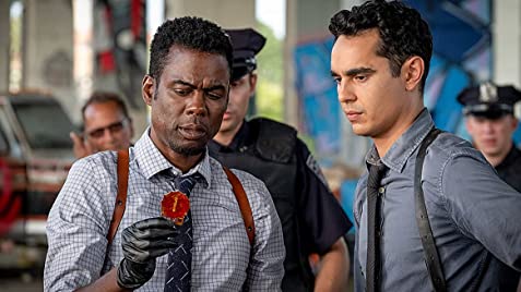 Zeke Banks (Chris Rock), and his partner, William Schenk (Max Minghella) investigate one of the murders happening in Spiral: From the Book of Saw.