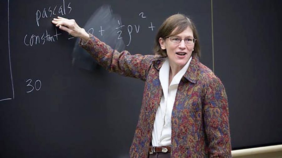 Professor Barbara Oakley at the blackboard working out an equation for her class. Her hard work and dedication have earned her notoriety as an influential voice in the world of Engineering.