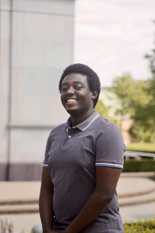 International student Ayman Ishimwe standing outside of Elliott Tower. A man of varied interests and talents, Ishimwe hopes to continue connecting with people and learning more about OU this school year.