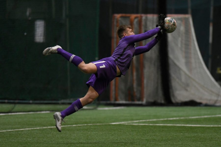 Finn Jurak lunging for a save on March 18, 2021 against Cleveland State. 