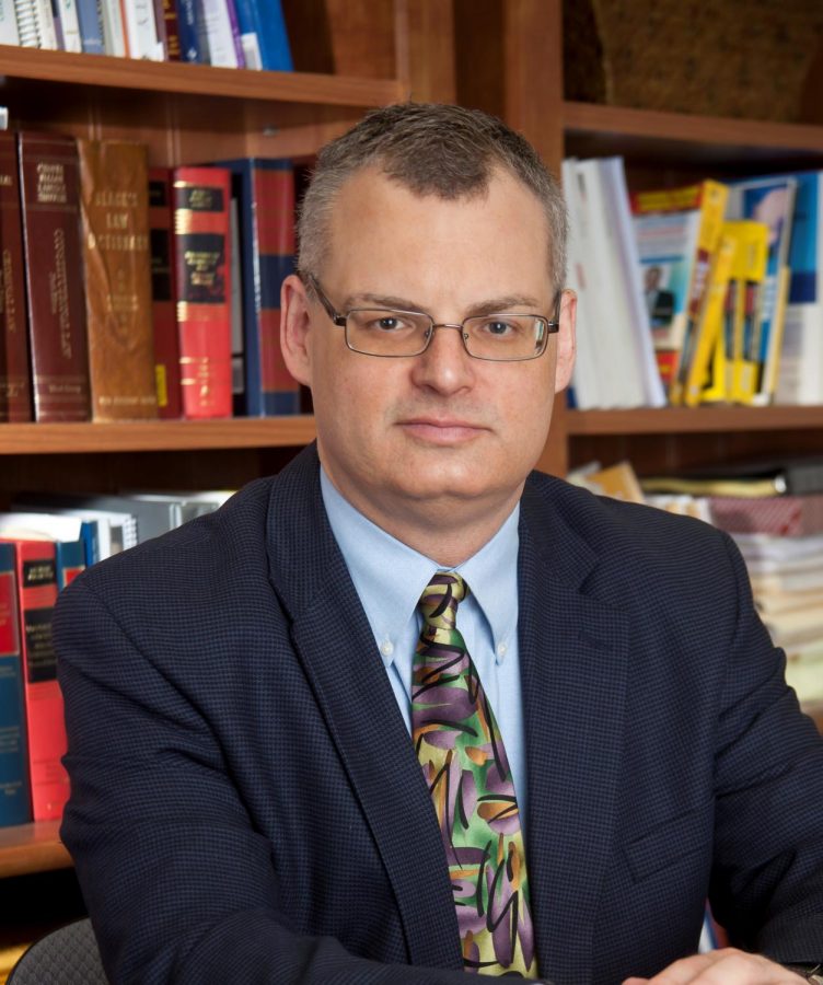 Associate Professor of Management Dr. Michael Greiner