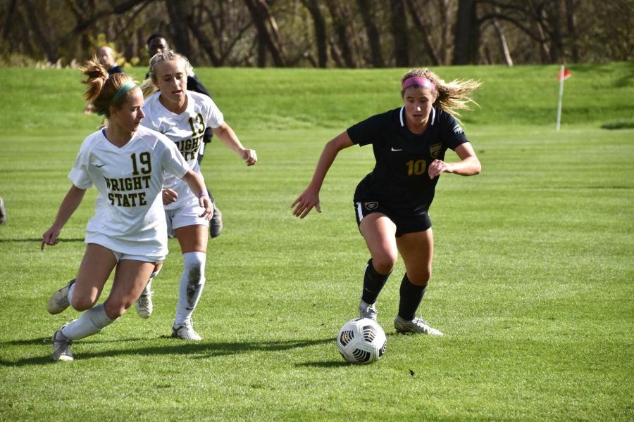 Macey Wierenga tries to escape defenders against Wright State on Oct. 17. 