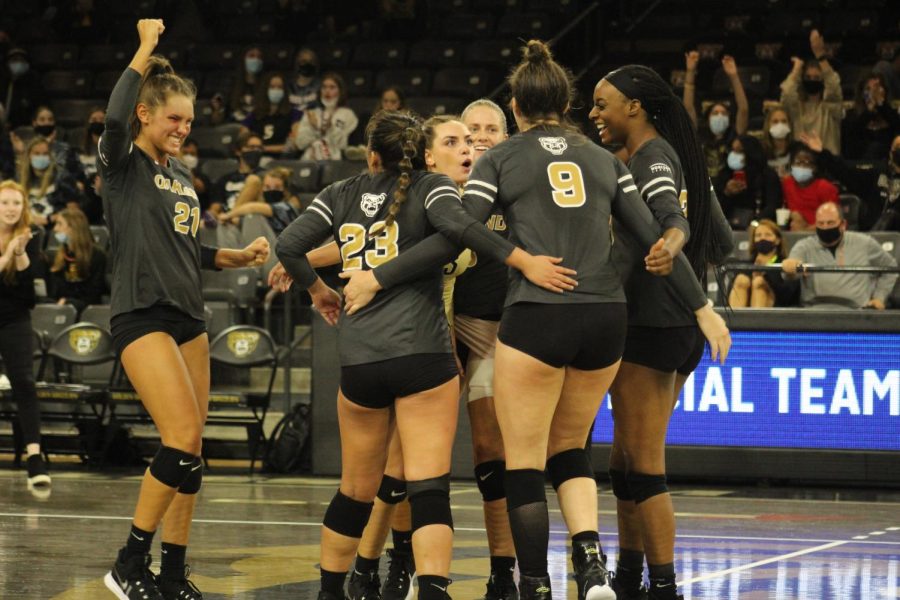 The volleyball team celebrates after getting a point against UIC on Oct. 8.