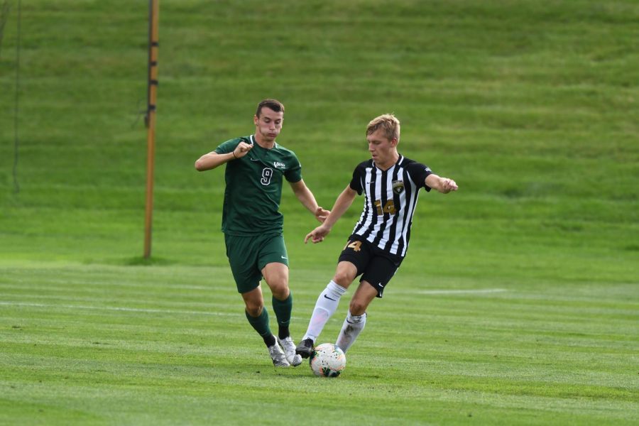 Ville Ahola tries to slip a defender against Cleveland State on Oct. 9