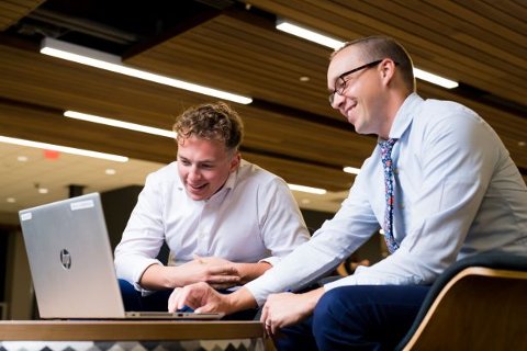 During his time at OU, graduate Cooper Hazel (left) conducted research on the economics of the legalization of marijuana. His economics professor Dr. Timothy Hodge (right) mentored Hazel during the project. 