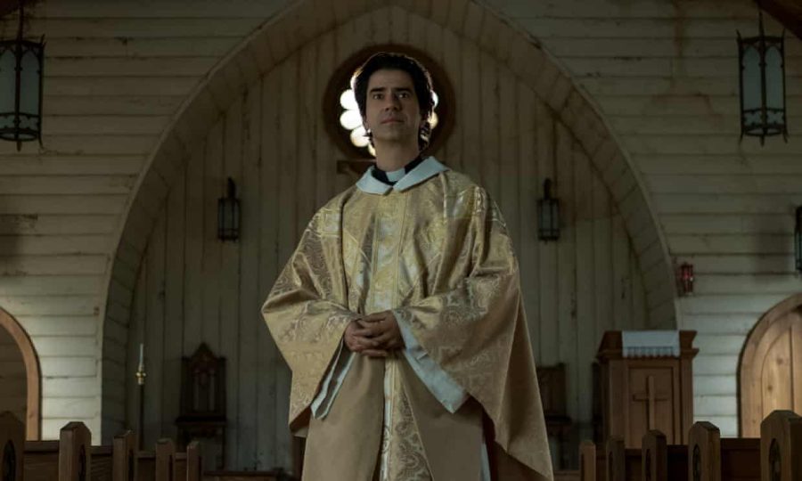 Pictured is Hamish Linklater as Father Paul in Midnight Mass. The Netflix series leads viewers down a path of contemplation about religion, death and more. 