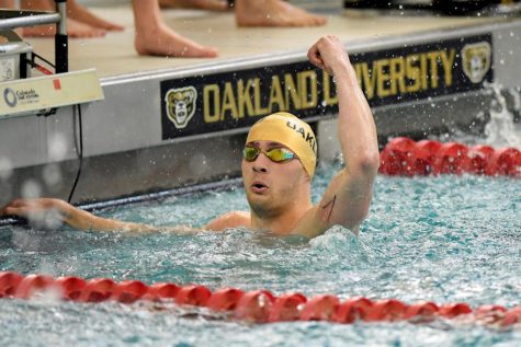 Christian Bart raises his fist in victory after winning a relay against Xavier. 