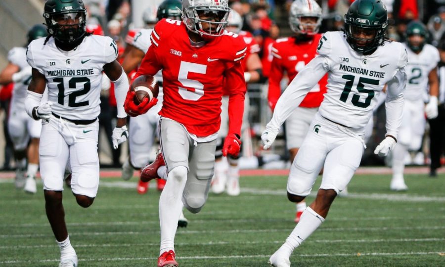 Garret Wilson takes off for a touchdown after catching a pass downfield against Michigan State on Nov. 20. 