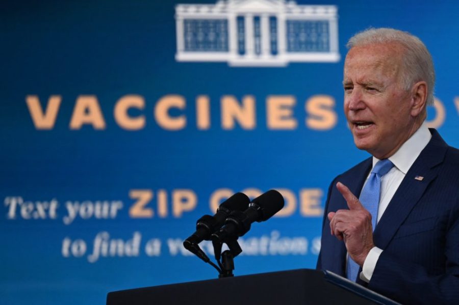 The+Biden+administration+announced+a+COVID-19+vaccination+mandate+for+U.S.+companies+with+100+or+more+workers.+The+mandate+will+be+enforced+starting+Jan.+4%2C+2022.