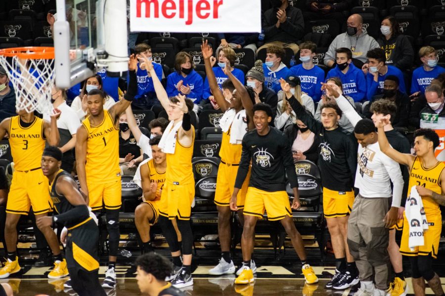 The Oakland men's basketball team's bench celebrates as they defeat Milwaukee in a rout on Jan. 9. 