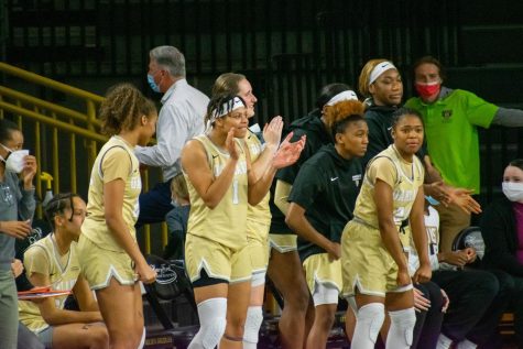 The Oakland bench celebrates as the team rolls to an easy victory over arch rival Detroit Mercy.