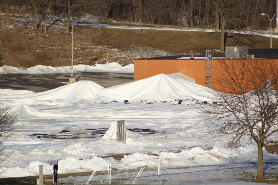 The process of repairing and re-inflating the collapsed Grizz Dome began Monday afternoon.
