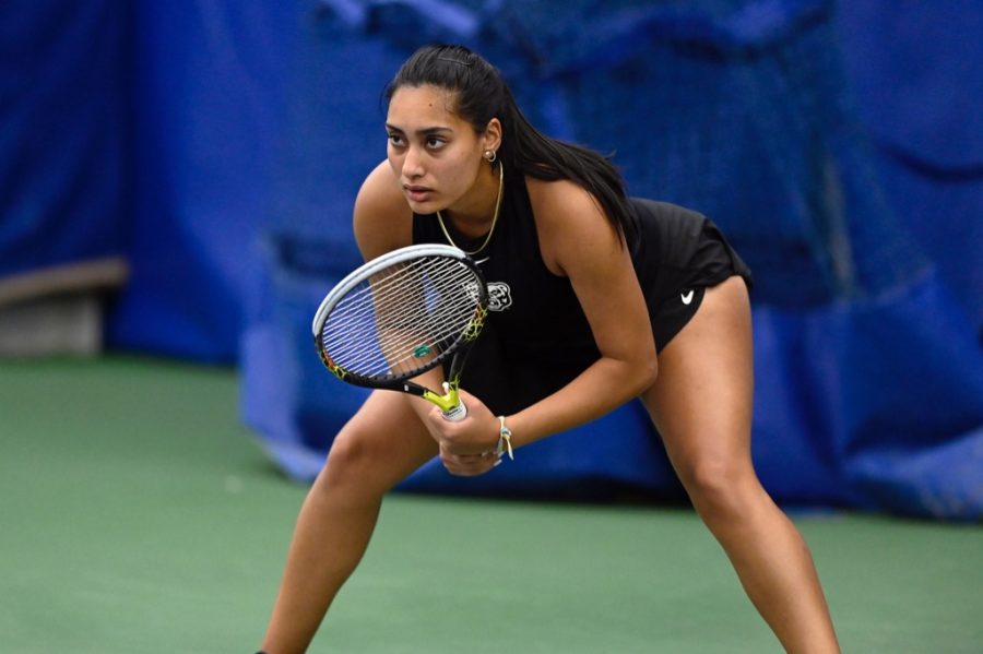 Nirva+Patel+gets+into+her+stance+while+the+opponent+gets+ready+to+serve+against+LSSU+on+March+19.+Photo+courtesy+of+OU+Athletics.