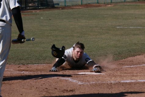 Brad Goulet slides head-first into home plate against SVSU on March 29.