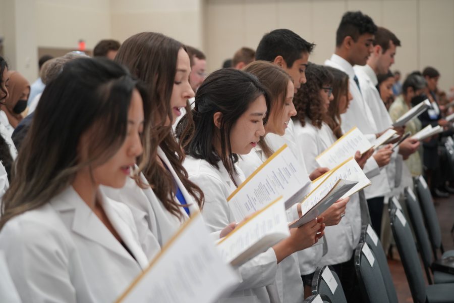 Members of OUWB's Class of 2026 recite the Oath of Geneva during the school's 2022 white coat ceremony.