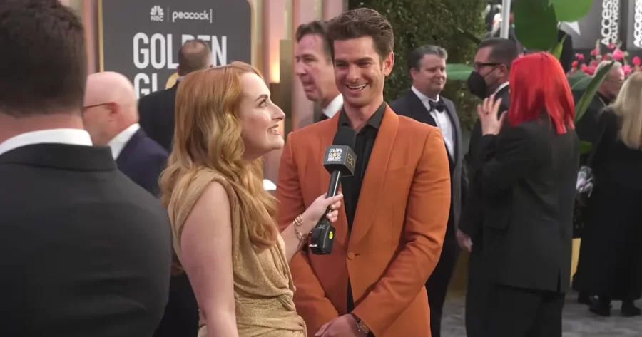 Chicken Shop Date creator Amelia Dimoldenberg and Andrew Garfield on the Golden Globes 2023 red carpet.