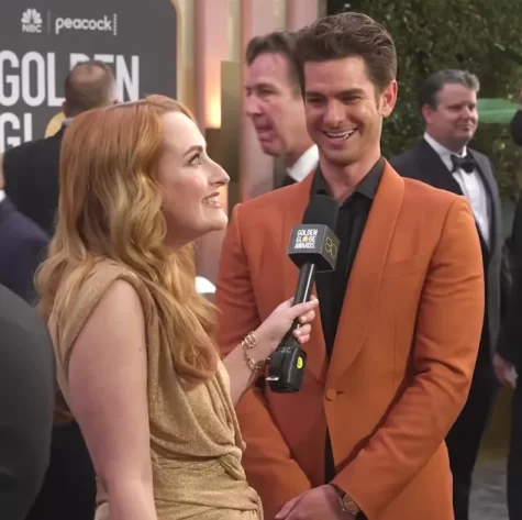 Chicken Shop Date creator Amelia Dimoldenberg and Andrew Garfield on the Golden Globes 2023 red carpet.